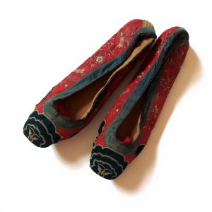 Pair of red embroidered Manchurian women's shoes with stitched leather soles
